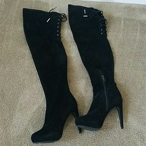 Thigh high black high heel boots